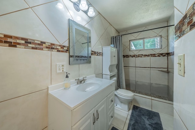 714 Macgregor Dr, Grand Prairie, TX 75050 - bathroom featuring vanity, tiled shower, and tile walls