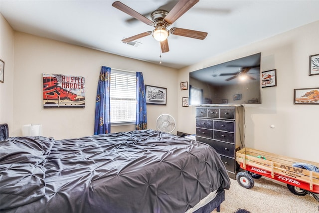 318 E Chestnut St, Denison, TX 75021 - bedroom with carpet floors and ceiling fan