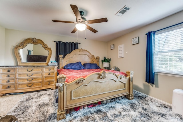 318 E Chestnut St, Denison, TX 75021 - carpeted bedroom with multiple windows and a ceiling fan
