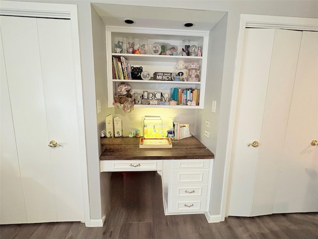 4124 Maryview Ct, Haltom City, TX 76117 - home office with dark wood-style floors, built in study area, and built in features