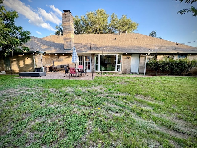 4124 Maryview Ct, Haltom City, TX 76117 - back of property with a patio, a yard, and a chimney