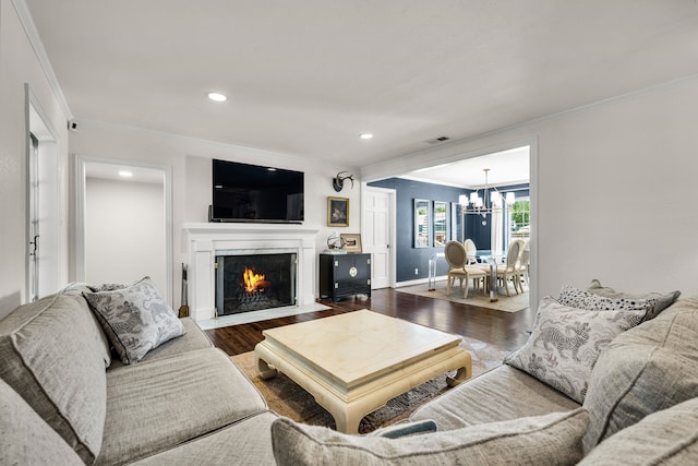 4903 Wateka Dr, Dallas, TX 75209 - living room with crown molding, a chandelier, wood finished floors, a fireplace with flush hearth, and recessed lighting