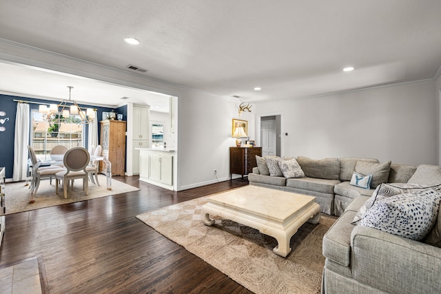 4903 Wateka Dr, Dallas, TX 75209 - living room featuring ornamental molding, a chandelier, dark wood-type flooring, and recessed lighting