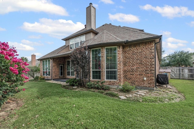 1904 Yarmouth Ct, Mansfield, TX 76063 - back of property with brick siding, a chimney, and a shingled roof