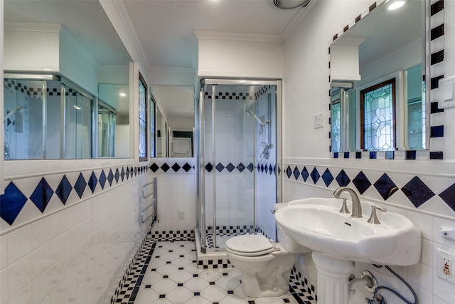4818 Thunder Rd, Dallas, TX 75244 - bathroom with tile walls, a stall shower, ornamental molding, and a wainscoted wall