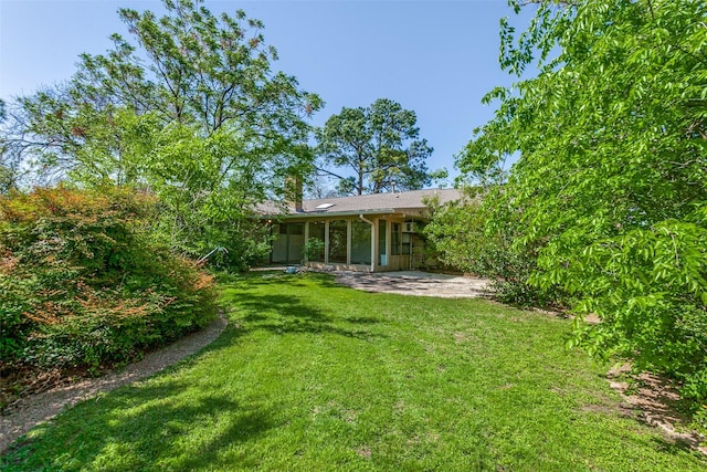 4818 Thunder Rd, Dallas, TX 75244 - back of property featuring a lawn, a sunroom, and a patio