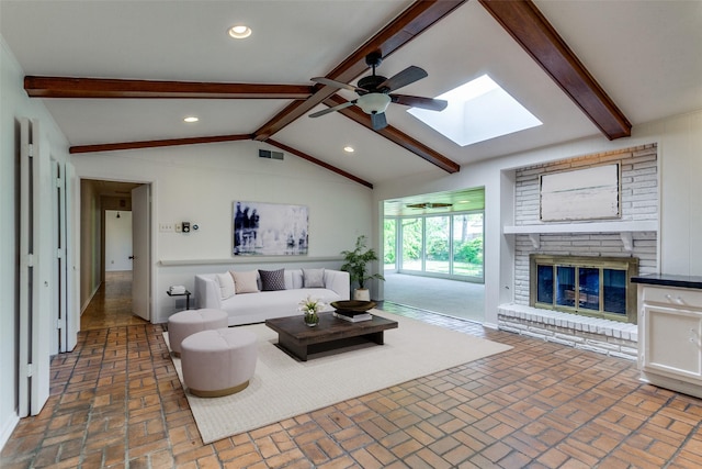 4818 Thunder Rd, Dallas, TX 75244 - living room with brick patterned floors, a skylight, a brick fireplace, a ceiling fan, and recessed lighting