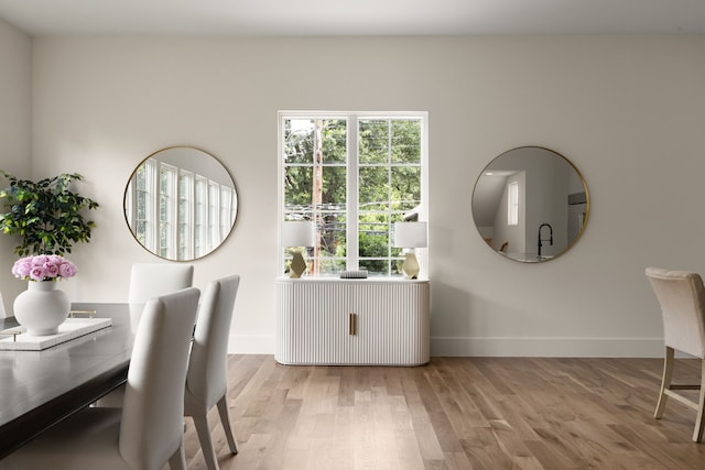 3939 Hawthorne Unit 103, Dallas, TX 75219 - dining room with light wood-style flooring and baseboards