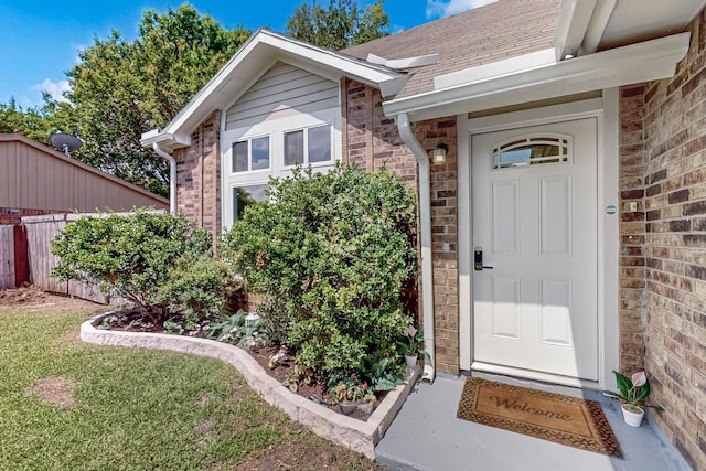1521 Windsor Dr, Glenn Heights, TX 75154 - view of exterior entry with brick siding and a shingled roof