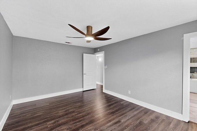 1521 Windsor Dr, Glenn Heights, TX 75154 - unfurnished bedroom featuring dark wood-type flooring, ceiling fan, and ensuite bathroom