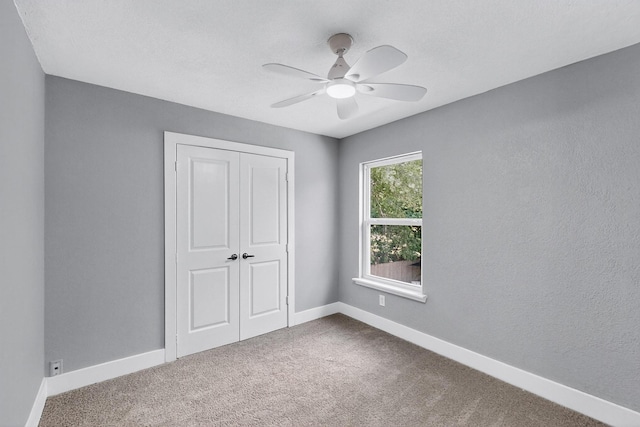 1521 Windsor Dr, Glenn Heights, TX 75154 - unfurnished bedroom featuring carpet floors, a closet, and a ceiling fan