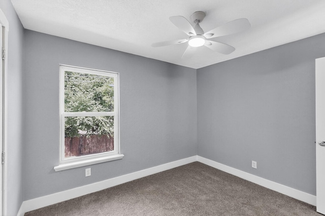 1521 Windsor Dr, Glenn Heights, TX 75154 - unfurnished room with dark colored carpet and ceiling fan