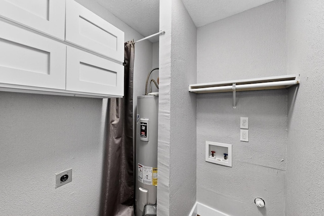 1521 Windsor Dr, Glenn Heights, TX 75154 - washroom featuring electric dryer hookup, water heater, and cabinet space