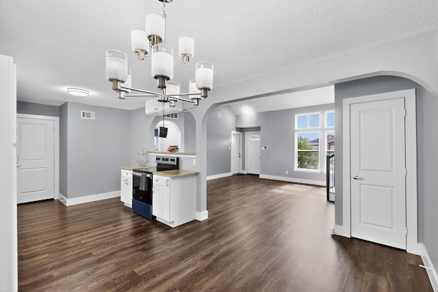 1521 Windsor Dr, Glenn Heights, TX 75154 - kitchen featuring stainless steel electric stove, arched walkways, dark wood-type flooring, and a textured ceiling