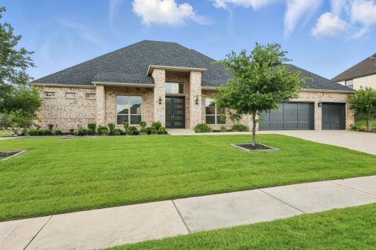 521 Winslow Ln, Prosper, TX 75078 - view of front of home featuring driveway, an attached garage, and a front yard