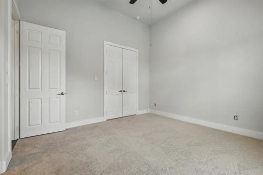 521 Winslow Ln, Prosper, TX 75078 - unfurnished bedroom featuring carpet flooring, a closet, and a ceiling fan