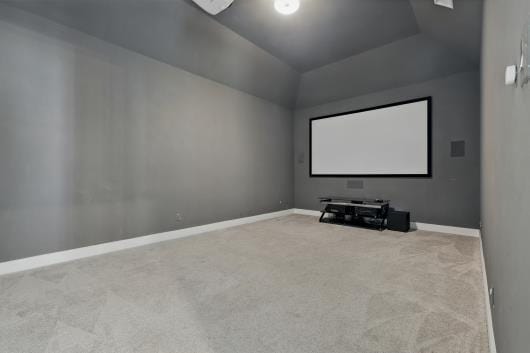 521 Winslow Ln, Prosper, TX 75078 - carpeted cinema featuring baseboards and vaulted ceiling