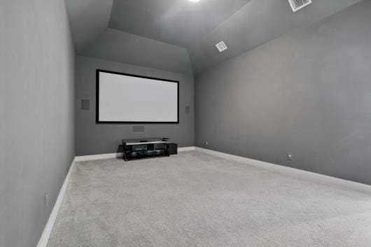 521 Winslow Ln, Prosper, TX 75078 - carpeted cinema featuring baseboards and lofted ceiling