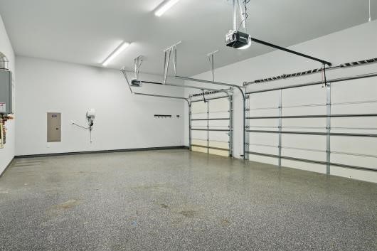 521 Winslow Ln, Prosper, TX 75078 - garage with a garage door opener, water heater, and electric panel