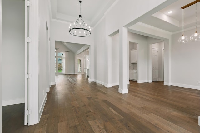 521 Winslow Ln, Prosper, TX 75078 - entryway featuring a raised ceiling, a chandelier, crown molding, and dark wood-style flooring