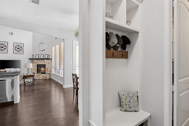 605 Pine Island Cir, Mansfield, TX 76063 - mudroom featuring dark wood-type flooring and a stone fireplace