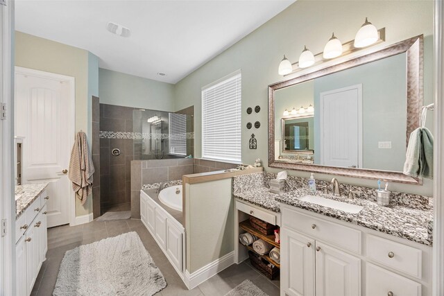 605 Pine Island Cir, Mansfield, TX 76063 - bathroom with vanity, tile patterned floors, a walk in shower, and a garden tub