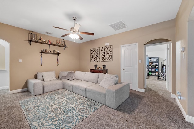 605 Pine Island Cir, Mansfield, TX 76063 - carpeted living area with arched walkways and ceiling fan