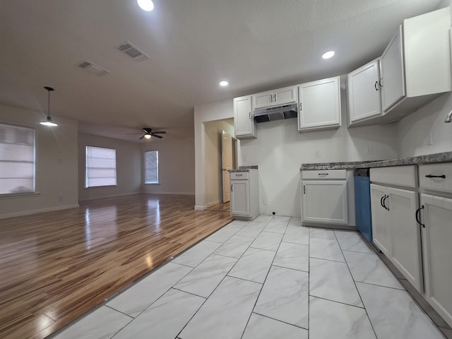 1513 Skyline Dr, River Oaks, TX 76114 - kitchen featuring under cabinet range hood, ceiling fan, recessed lighting, open floor plan, and white cabinets