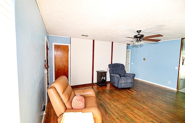 1561 Fm 1816, Bowie, TX 76230 - living room with a ceiling fan, wood finished floors, and a textured ceiling