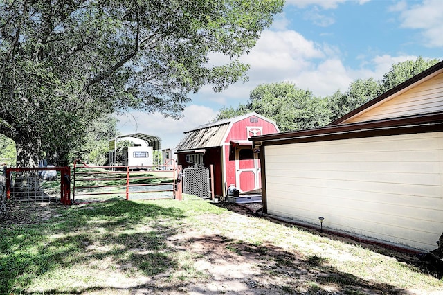 1561 Fm 1816, Bowie, TX 76230 - view of yard featuring a carport, a gate, and a shed