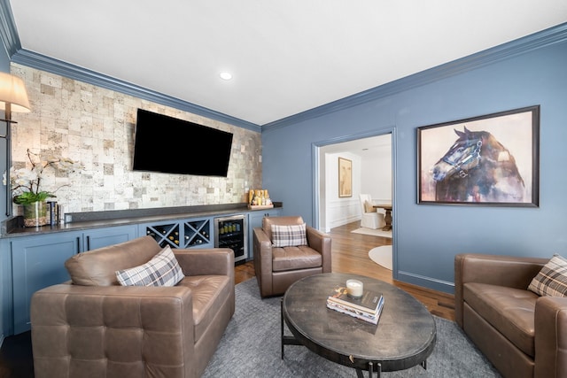 750 Camden Way, Prosper, TX 75078 - living area featuring a bar, ornamental molding, wood finished floors, and recessed lighting