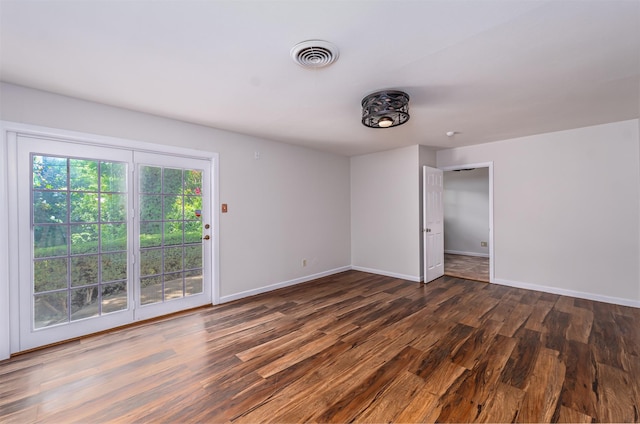 5912 Whitman Ave, Fort Worth, TX 76133 - unfurnished bedroom with wood finished floors and access to exterior