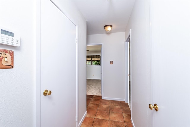 5912 Whitman Ave, Fort Worth, TX 76133 - hall with dark tile patterned flooring and baseboards