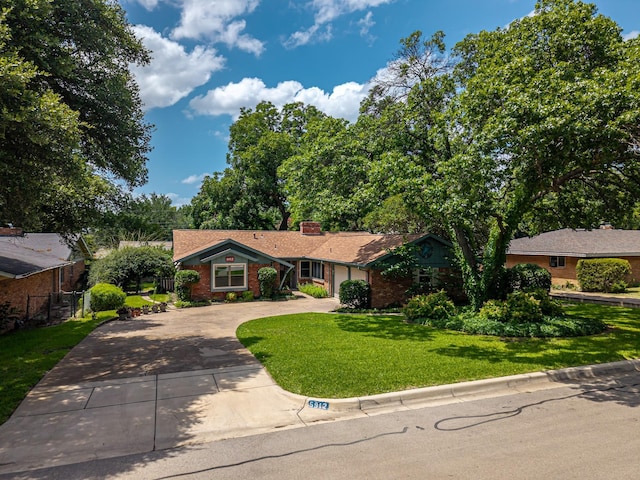 5912 Whitman Ave, Fort Worth, TX 76133 - ranch-style house with curved driveway, brick siding, and a chimney