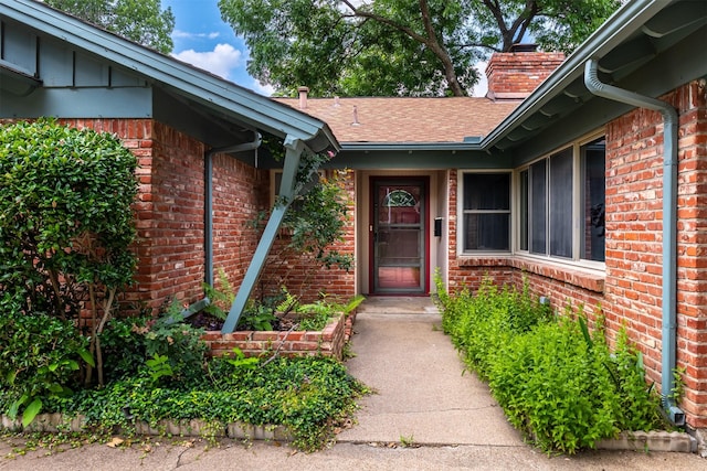 5912 Whitman Ave, Fort Worth, TX 76133 - entrance to property with brick siding, a chimney, and roof with shingles