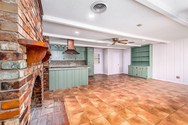 5912 Whitman Ave, Fort Worth, TX 76133 - kitchen with green cabinets, island range hood, backsplash, a ceiling fan, and beam ceiling