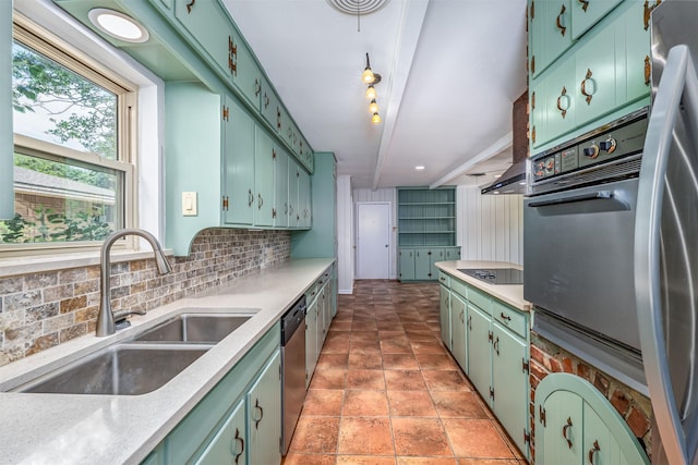 5912 Whitman Ave, Fort Worth, TX 76133 - kitchen featuring stainless steel appliances, decorative backsplash, light countertops, and green cabinets