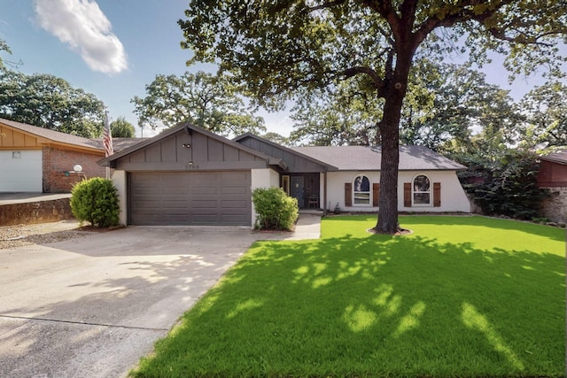 5700 Kingstree Ct, Arlington, TX 76017 - ranch-style home featuring a garage, concrete driveway, a front lawn, and board and batten siding