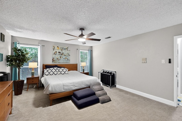 5700 Kingstree Ct, Arlington, TX 76017 - bedroom with light colored carpet, ceiling fan, and a textured ceiling