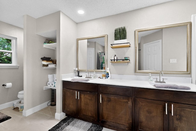 5700 Kingstree Ct, Arlington, TX 76017 - full bathroom featuring double vanity, a textured ceiling, and tile patterned floors