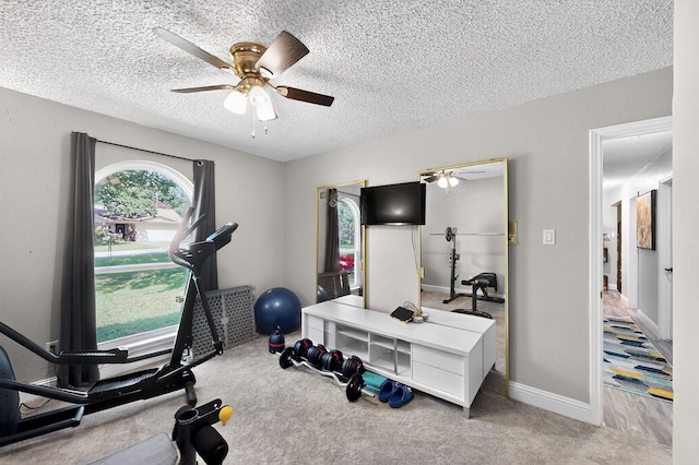 5700 Kingstree Ct, Arlington, TX 76017 - workout area featuring ceiling fan, carpet flooring, and a textured ceiling