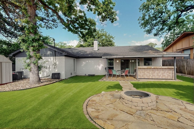5700 Kingstree Ct, Arlington, TX 76017 - rear view of property featuring a patio area, brick siding, a fire pit, and a chimney