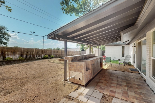 5700 Kingstree Ct, Arlington, TX 76017 - fenced backyard featuring a patio area and a sink