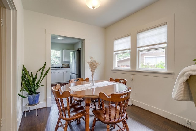 4711 Birchman Ave, Fort Worth, TX 76107 - dining room with baseboards and dark wood-type flooring