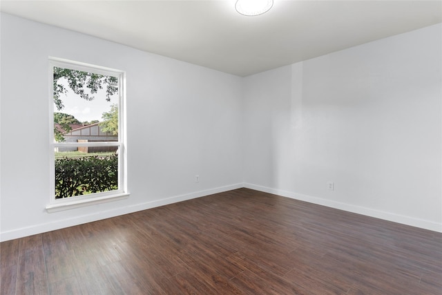 1007 Elk Grove Dr, Richardson, TX 75081 - spare room featuring dark wood finished floors and baseboards