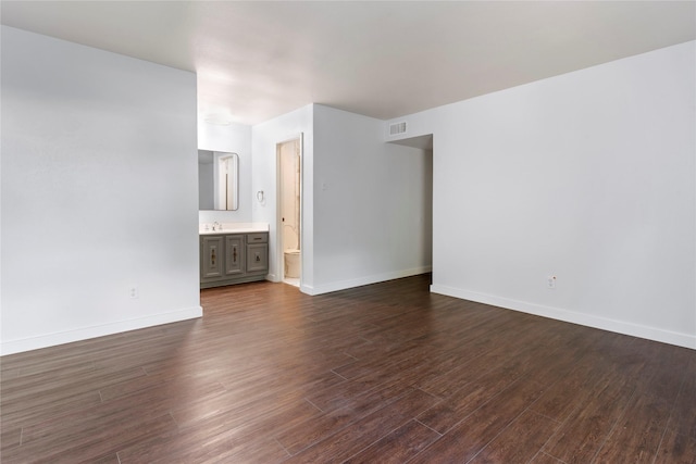 1007 Elk Grove Dr, Richardson, TX 75081 - unfurnished room with dark wood-type flooring and baseboards