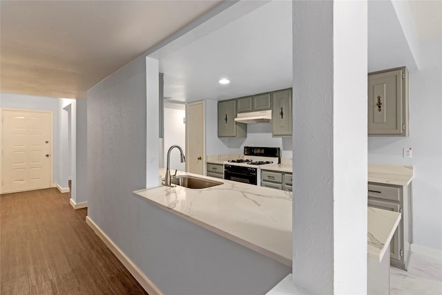 1007 Elk Grove Dr, Richardson, TX 75081 - kitchen featuring range with gas stovetop, gray cabinets, under cabinet range hood, recessed lighting, and light stone counters