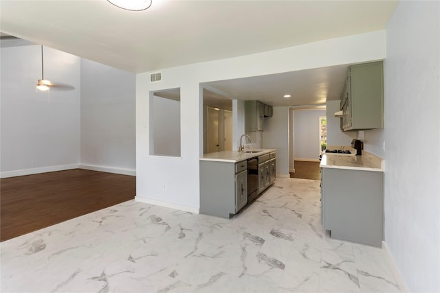 1007 Elk Grove Dr, Richardson, TX 75081 - kitchen featuring gray cabinetry, light countertops, dishwasher, ceiling fan, and light marble finish flooring