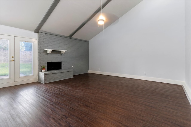 1007 Elk Grove Dr, Richardson, TX 75081 - unfurnished living room featuring dark wood finished floors, a brick fireplace, and french doors