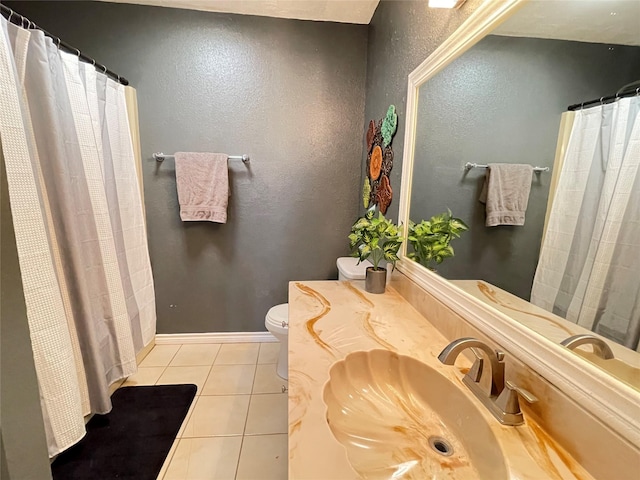101 Branch St, Pittsburg, TX 75686 - full bathroom with tile patterned floors, a textured wall, vanity, and a shower with shower curtain